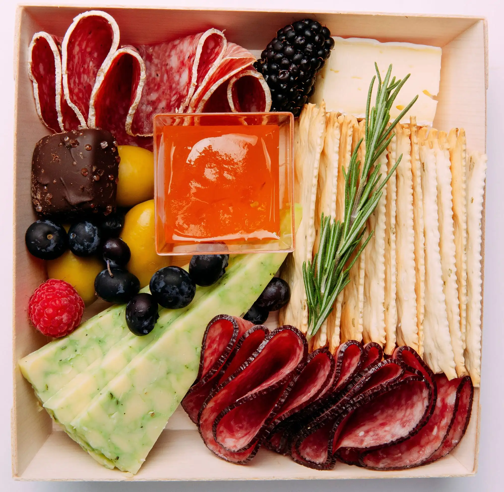 Individual charcuterie box with brie, salami, crackers, olives and fruit (view 6)