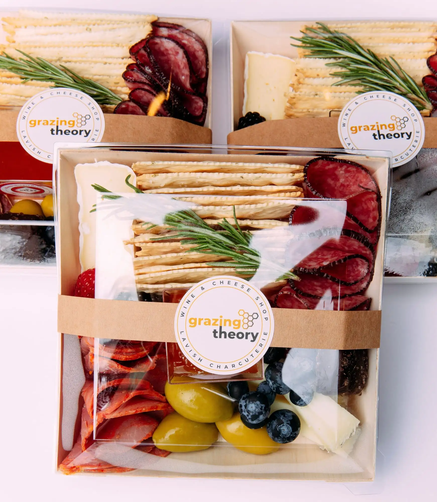 Individual charcuterie box with brie, salami, crackers, olives and fruit (view 3)